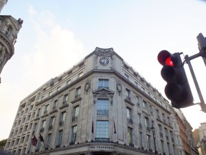 our room is on the fifth floor behind the clock, windows on either side look through stone balustrades